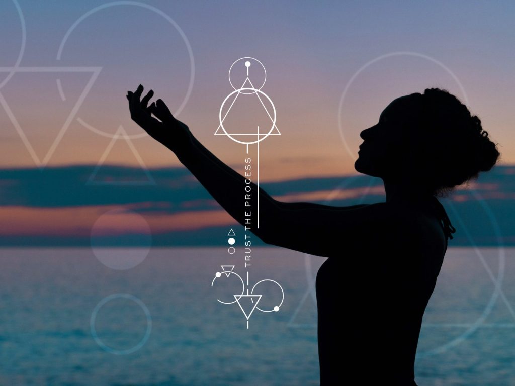 Silhouette of woman at sunset with geometric designs, highlighting the Flaska structured water bottle Empower Collection.